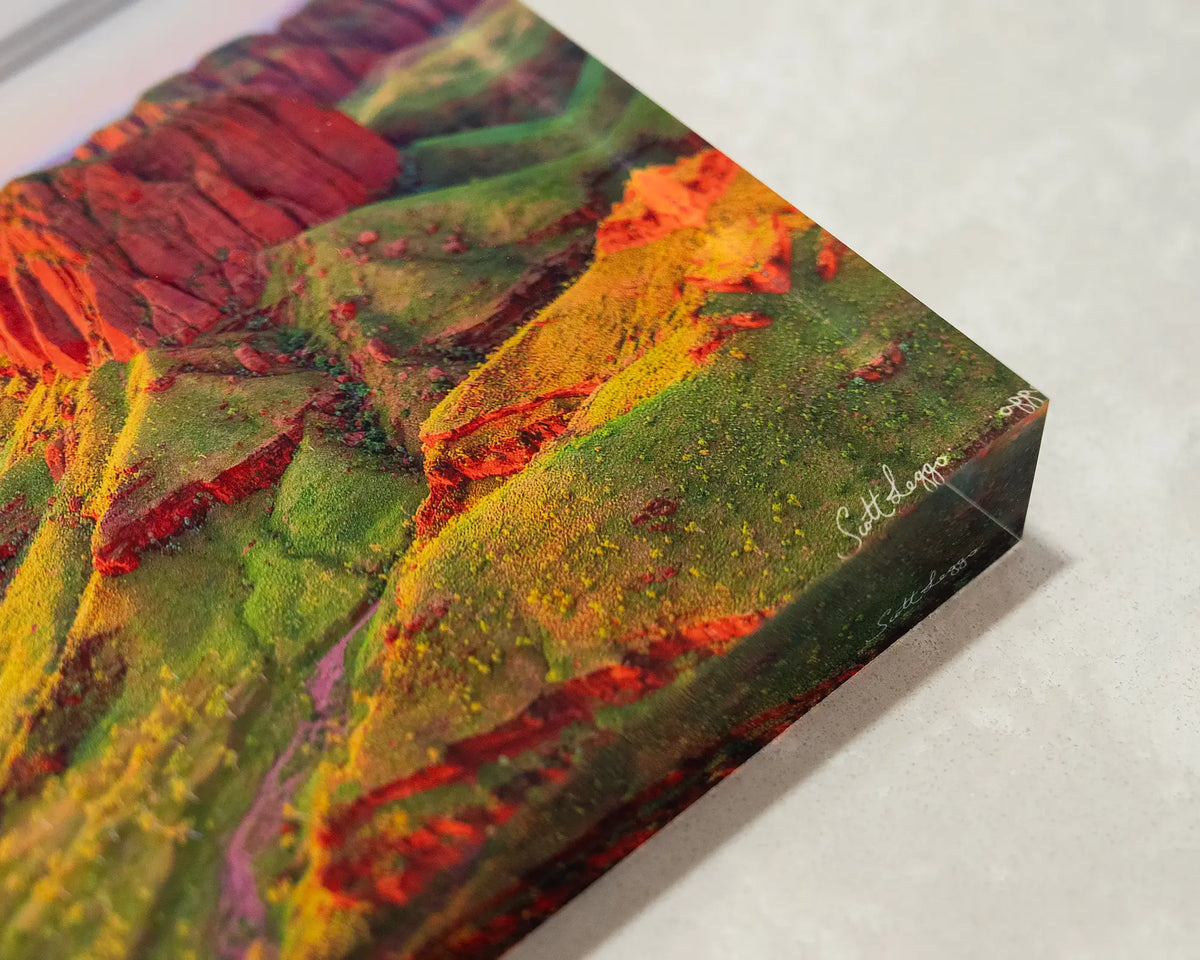 Kimberley Spirit. Acrylic block of Ragged Range, The Kimberley, Western Australia, laying flat on desk showing corner details.
