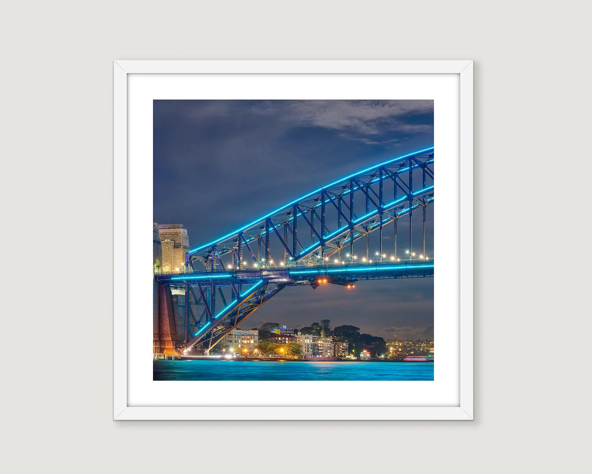 Framed wall art print of Sydney Harbour Bridge lit up at night during the Vivid Festival. 