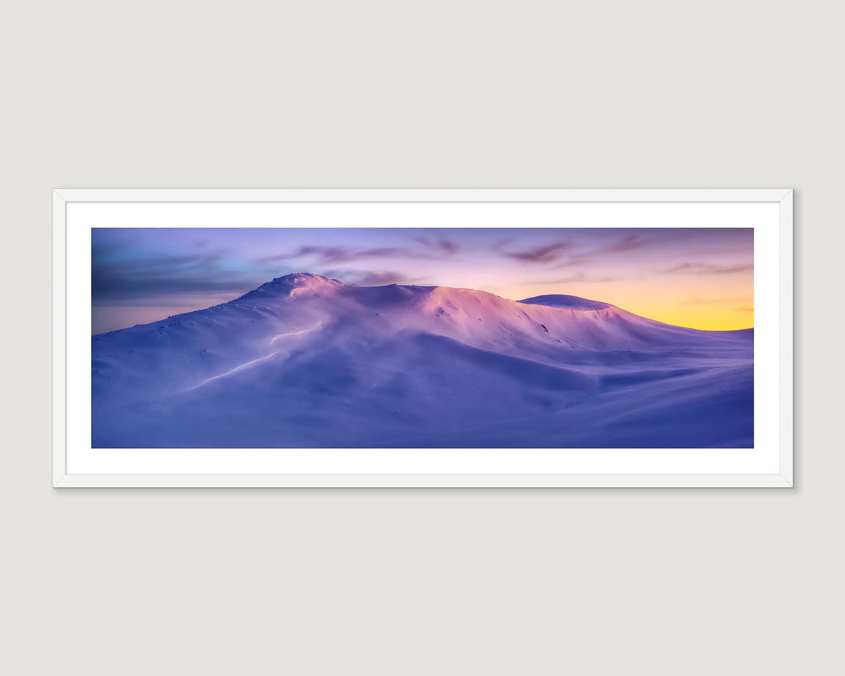 Framed wall art print of a colourful sunrise reflecting off the snow on Mount Kosciuszko.