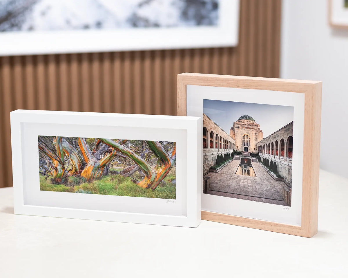 Kosi Colours small framed print sitting next to Sacrifice wall art.