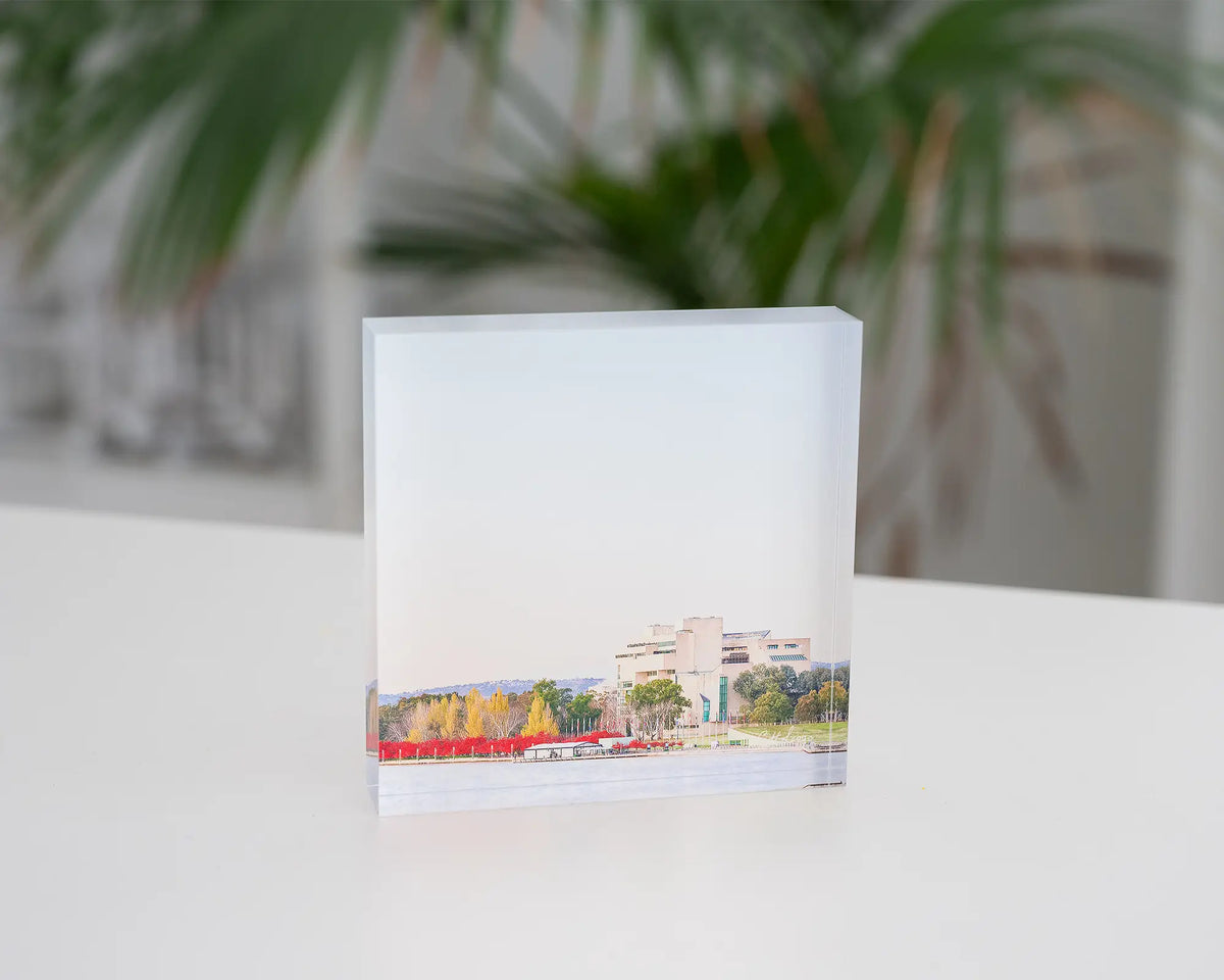 Lake Lookout. Acrylic block autumn sunrise at the High Court of Australia, styled on a desk.
