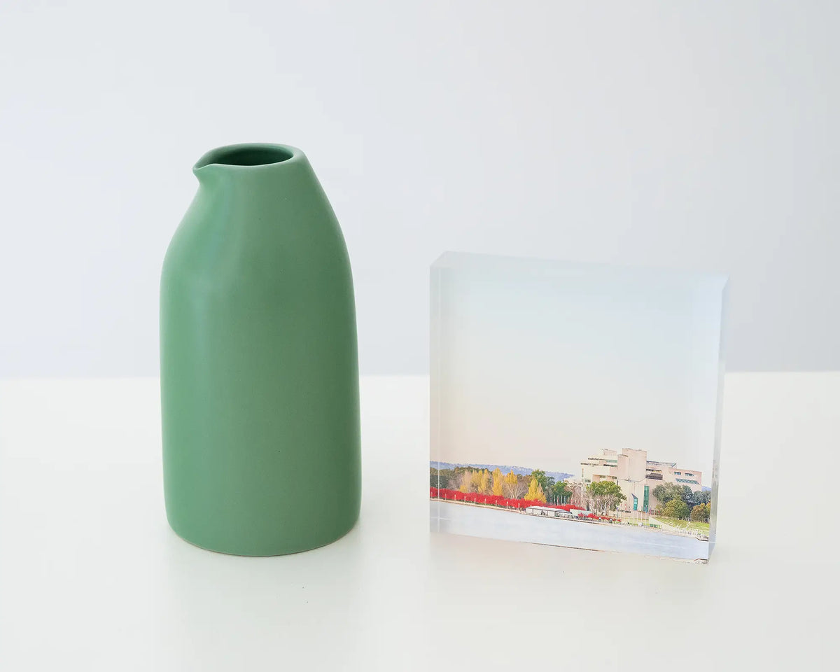 Lake Lookout. Acrylic block autumn sunrise at the High Court of Australia, styled with a small vase.