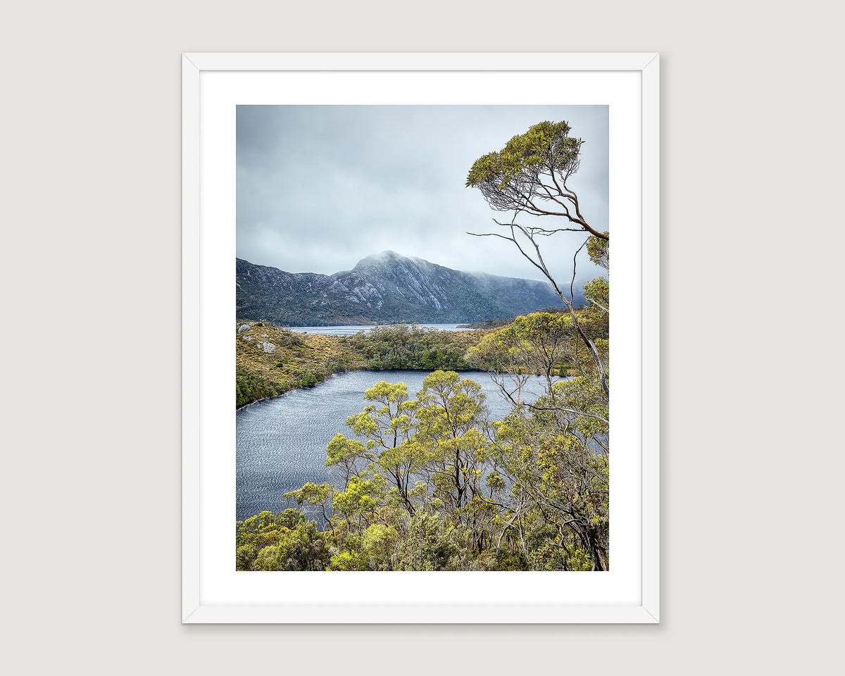 Framed wall art print of Cradle Mountain in fog with a lake and native bush in Tasmania. 