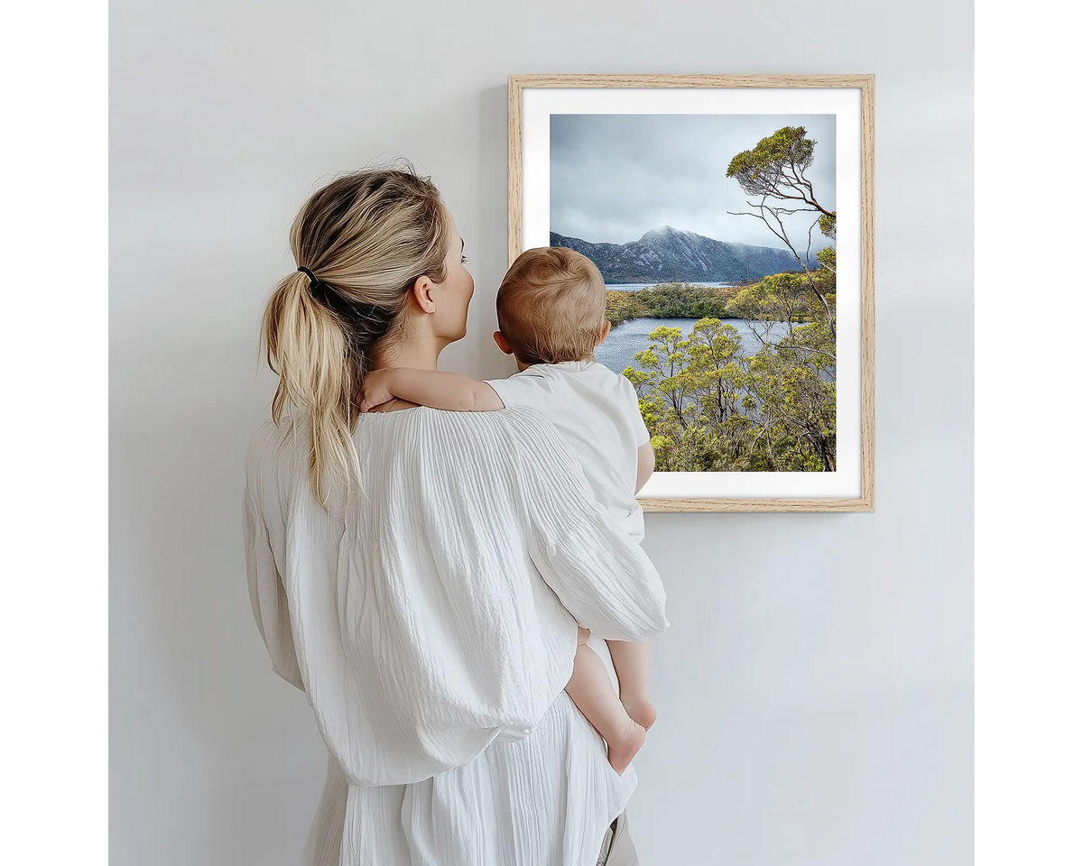 Lake View. Tasmanian photography artwork with a timber frame, being admired by a mother and baby. 