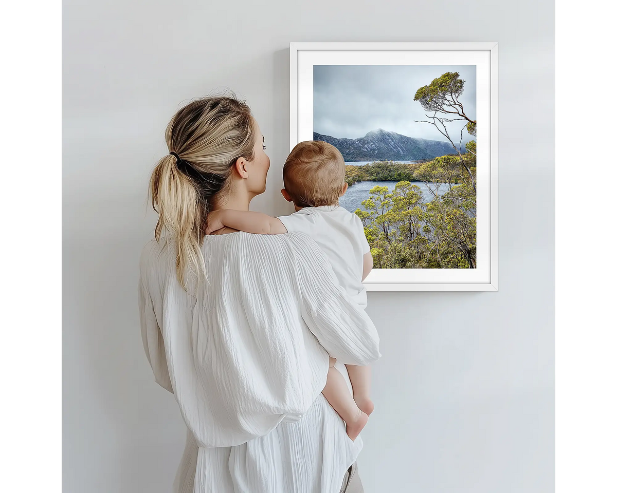 Lake View. Tasmanian photography artwork with a white frame, being admired by a mother and baby. 
