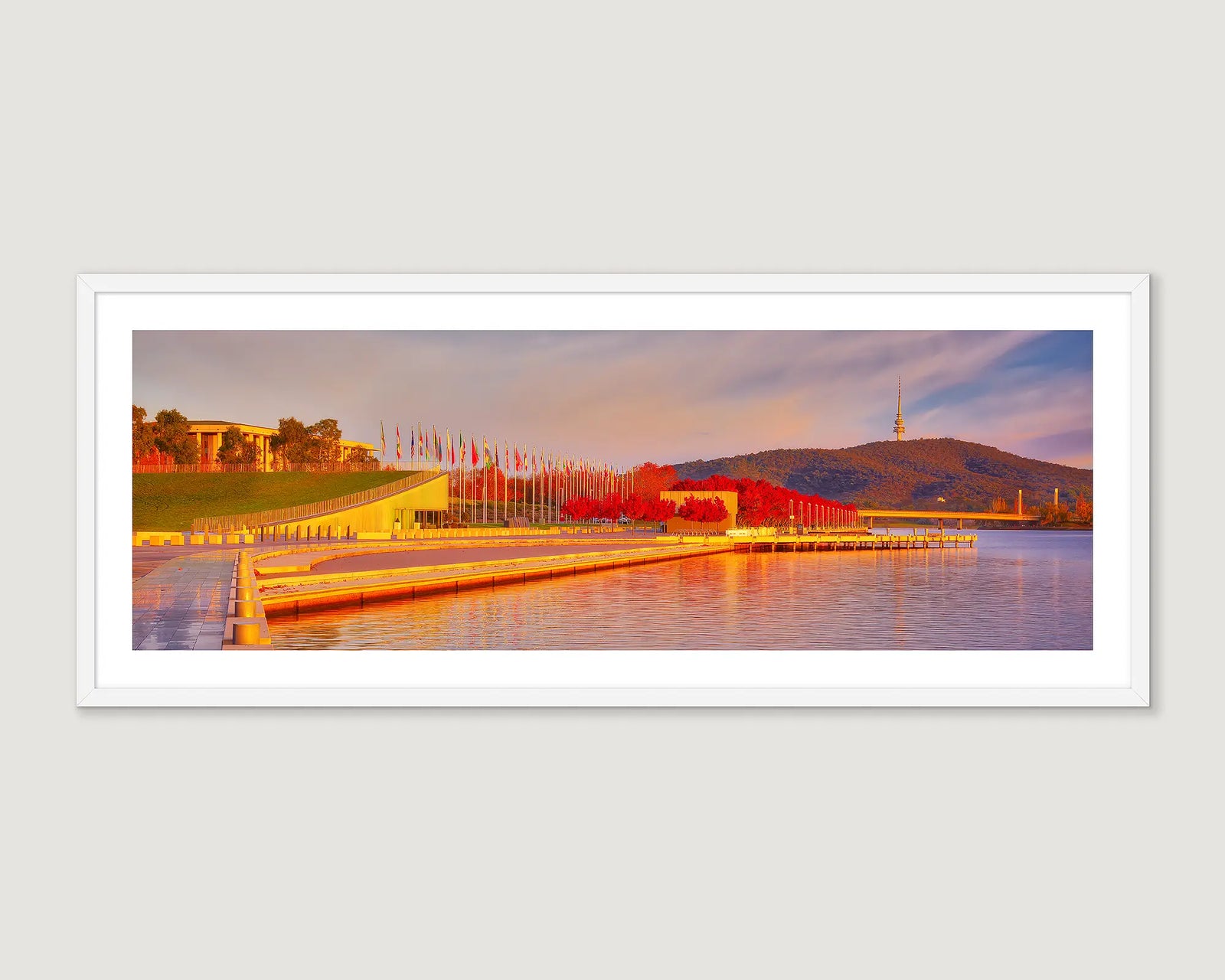 Framed wall art print of Lake Burley Griffin with trees turning red in autumn and a view to Black Mountain. 