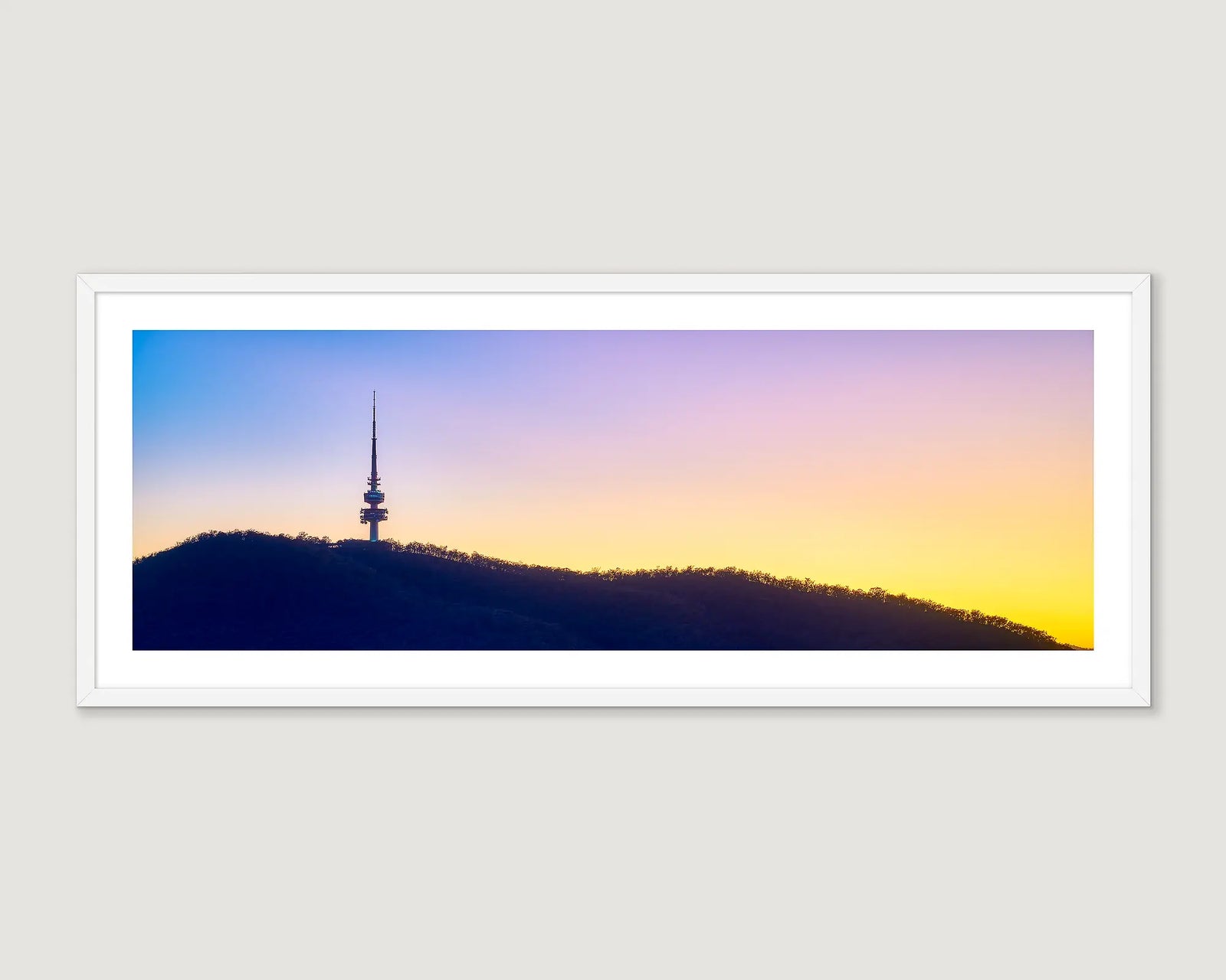 Framed photographic print of Black Mountain Tower with a colourful sky. 