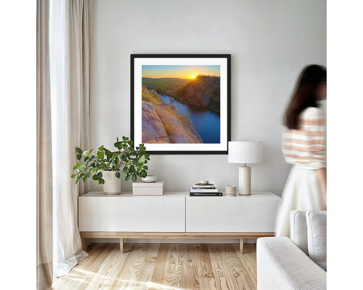 Last Light. Northern Territory wall art print with black frame hung in a small lounge room.