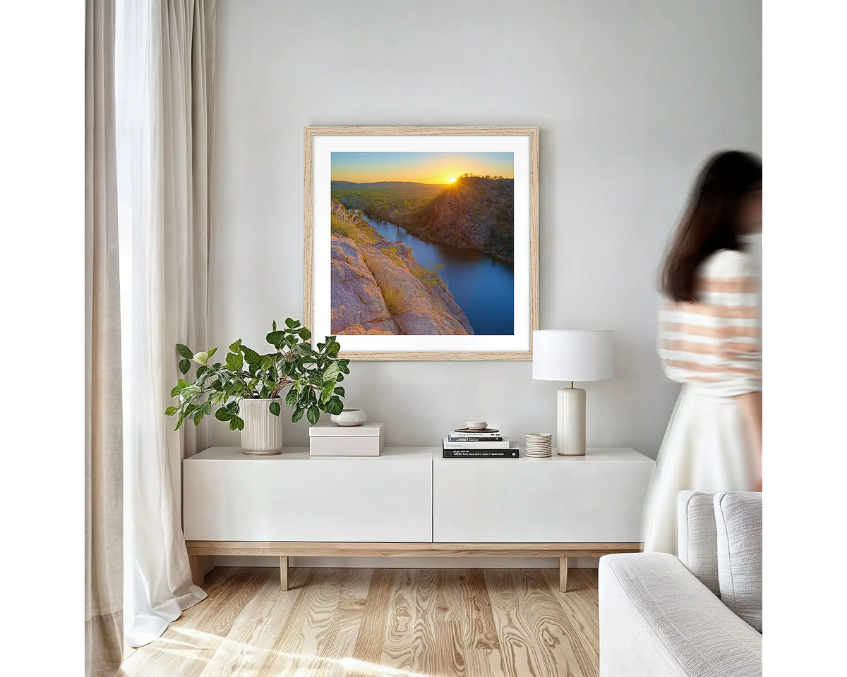 Last Light. Northern Territory wall art print with timber frame hung in a small lounge room.