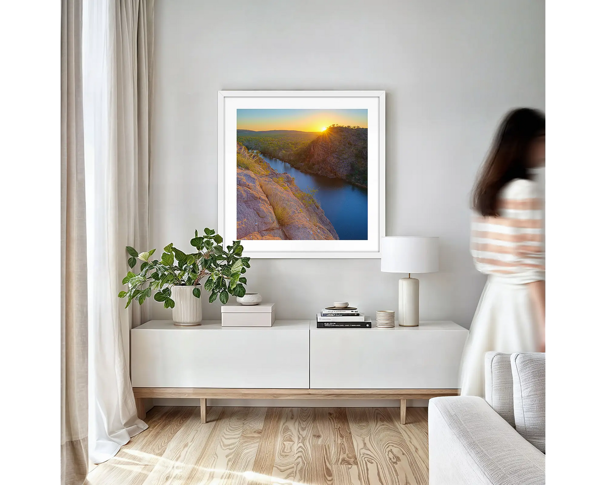 Last Light. Northern Territory wall art print with white frame hung in a small lounge room.