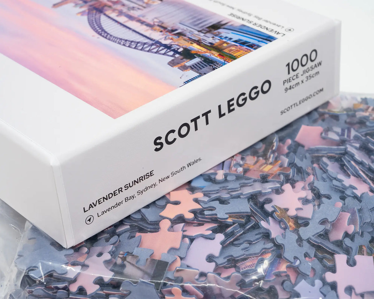 Lavender Sunrise. 1000 piece jigsaw puzzle open box showing puzzle pieces, Lavender Bay, Sydney.