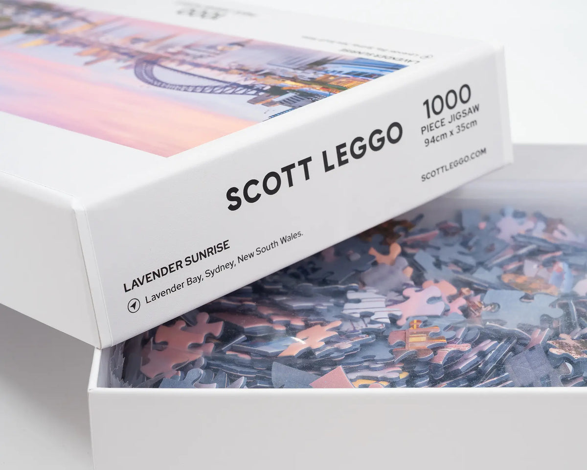 Lavender Sunrise. Sydney 1000 piece jigsaw puzzle Lavender Bay, with open lid showing puzzle pieces.
