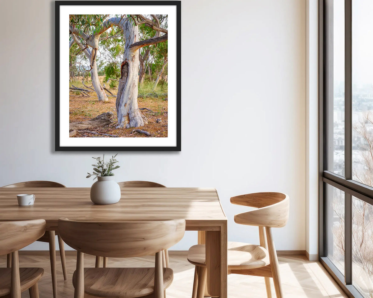 Left Behind. Black framed wall art hung on an apartment wall. 