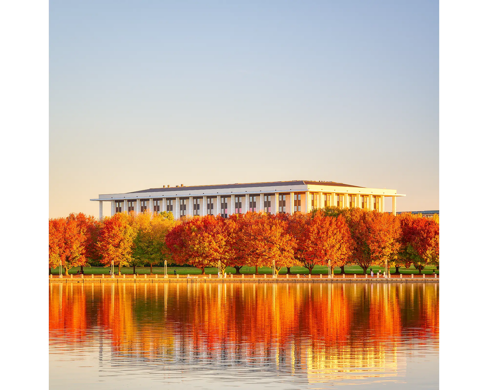 Library Reds. National Library Of Australia at sunset with red autumn colours.