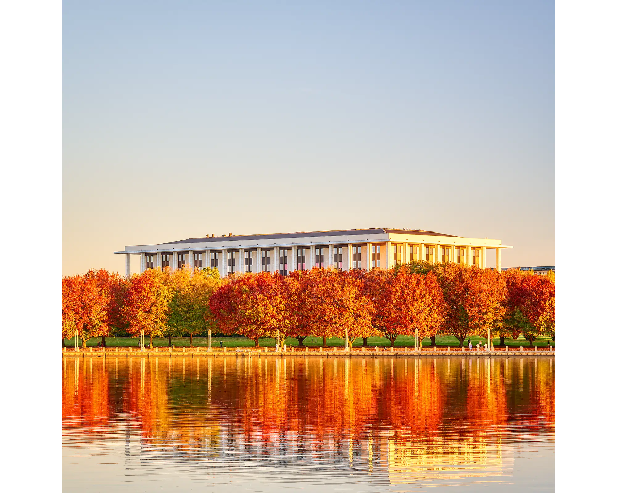 Library Reds. National Library Of Australia at sunset with red autumn colours.