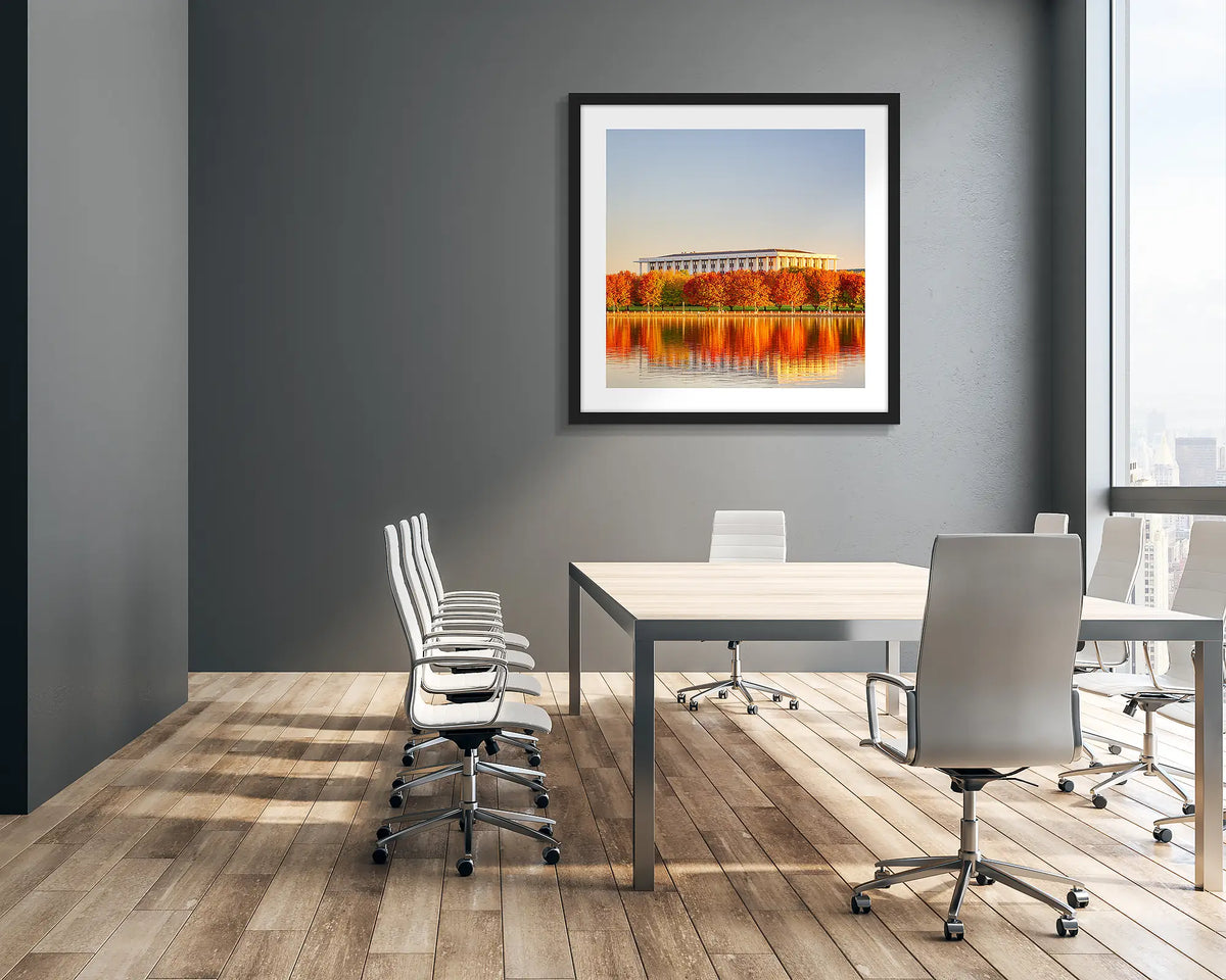 Library Reds.  National Library of Australia in Autumn wall art print with black frame hung in a company boardroom.