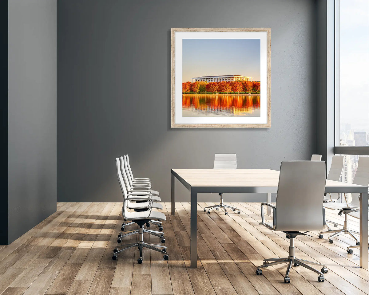 Library Reds.  National Library of Australia in Autumn wall art print with timber frame hung in a company boardroom.