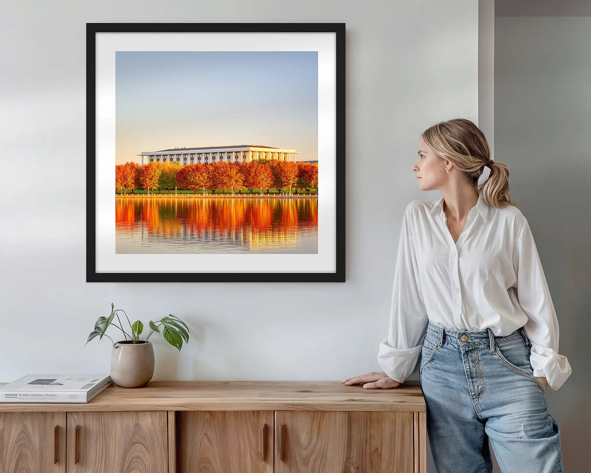 Library Reds. Wall art print with black frame featuring the National Library of Australia, hung above a side table.