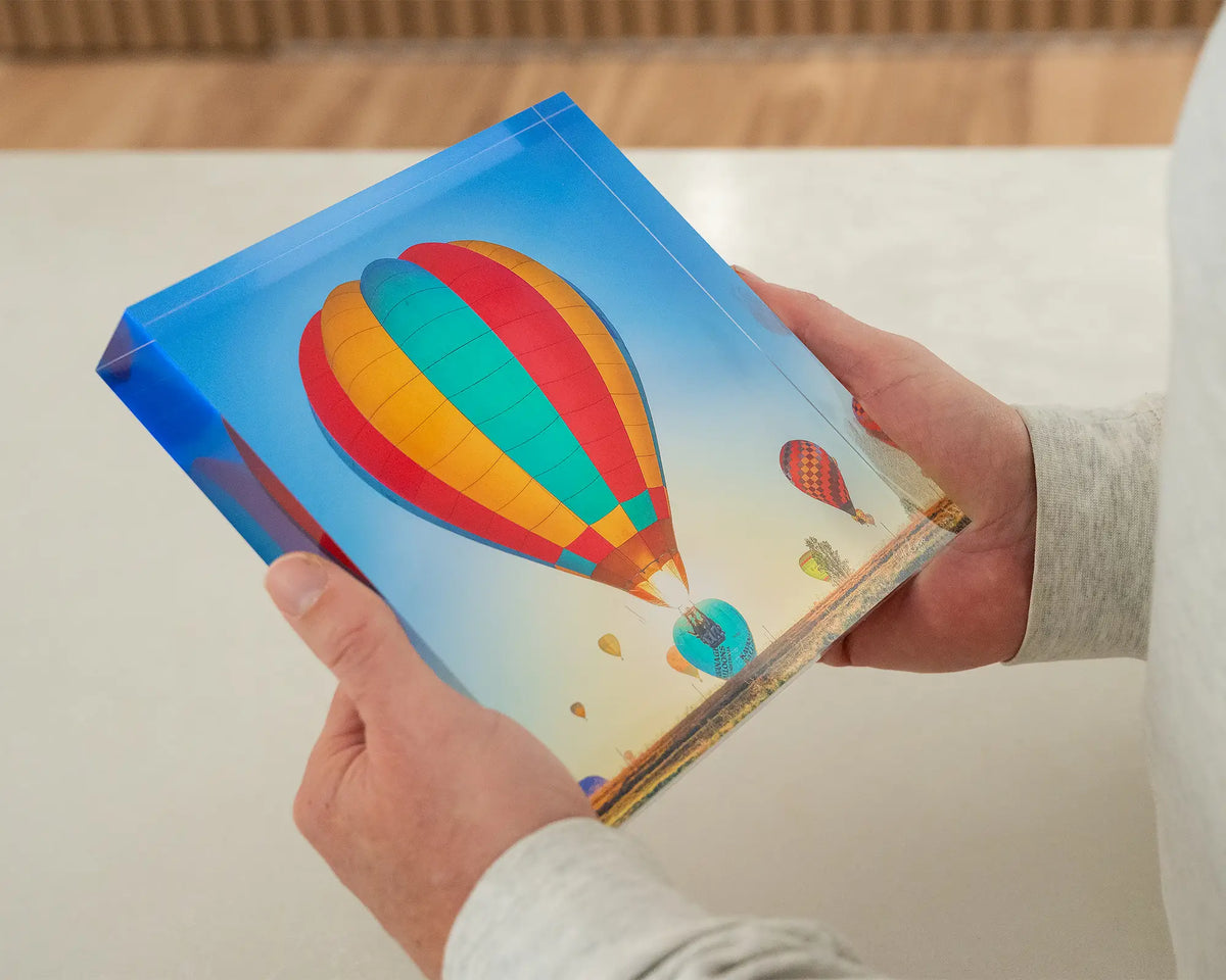 Lift. 19cm acrylic block Canberra Balloon Spectacular, hand held in gallery.