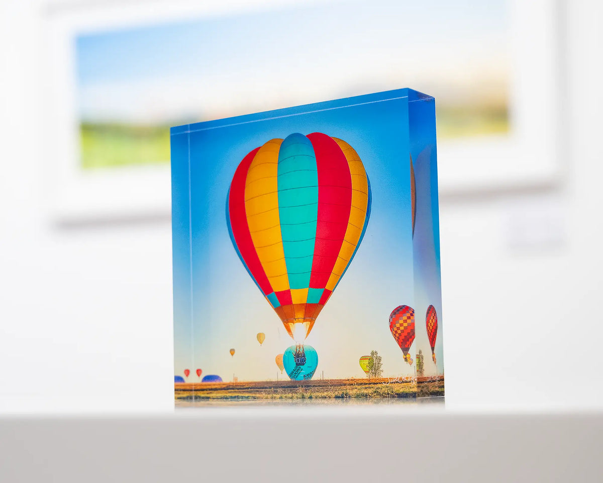 Lift. Acrylic block of hot air balloon sitting on desk.