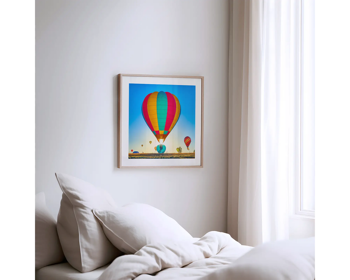 Lift. Canberra hot air balloon photography artwork with a timber frame, hung on a bedroom wall. 