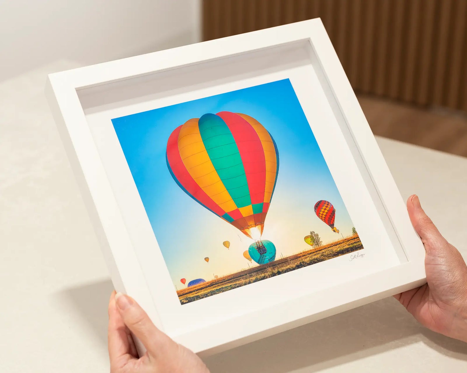 Framed wall art print of a colourful balloon at the Canberra Balloon Festival. 