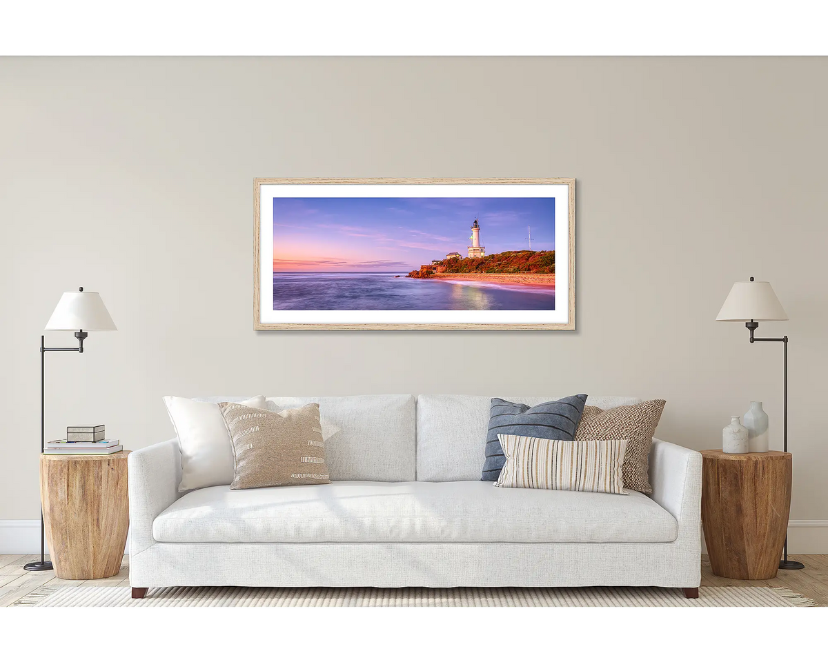 Light Me Up. Wall art print of Point Lonsdale lighthouse, framed with Tasmanian Oak frame, hung above couch.