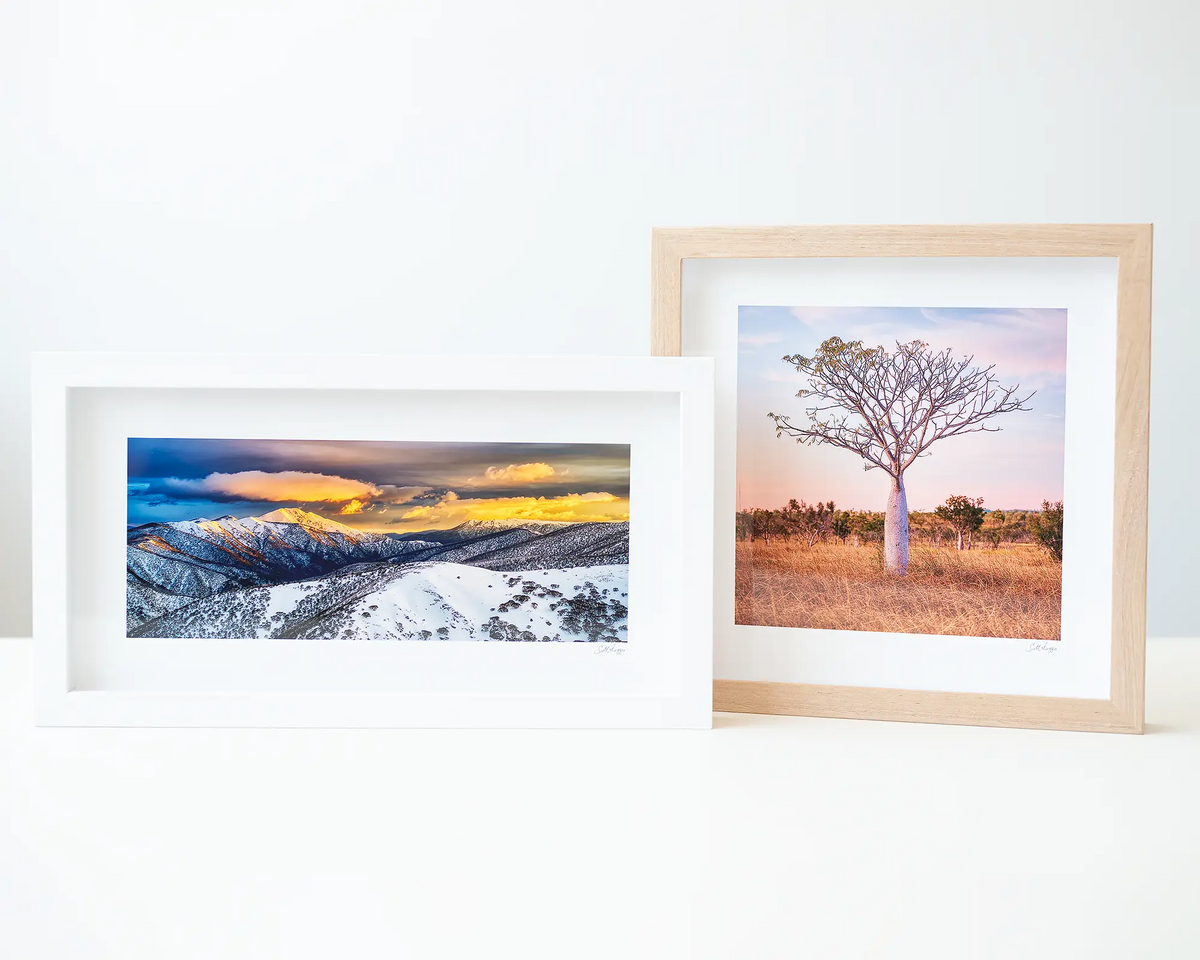Little One and Alpine Magic small framed prints sitting next to each other.