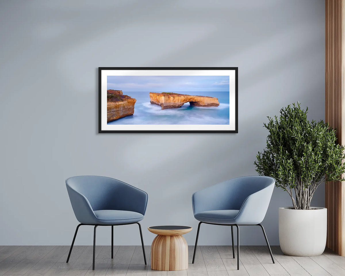 London Bridge. Great Ocean Road wall art print, framed with a black frame and hung in a waiting room. 