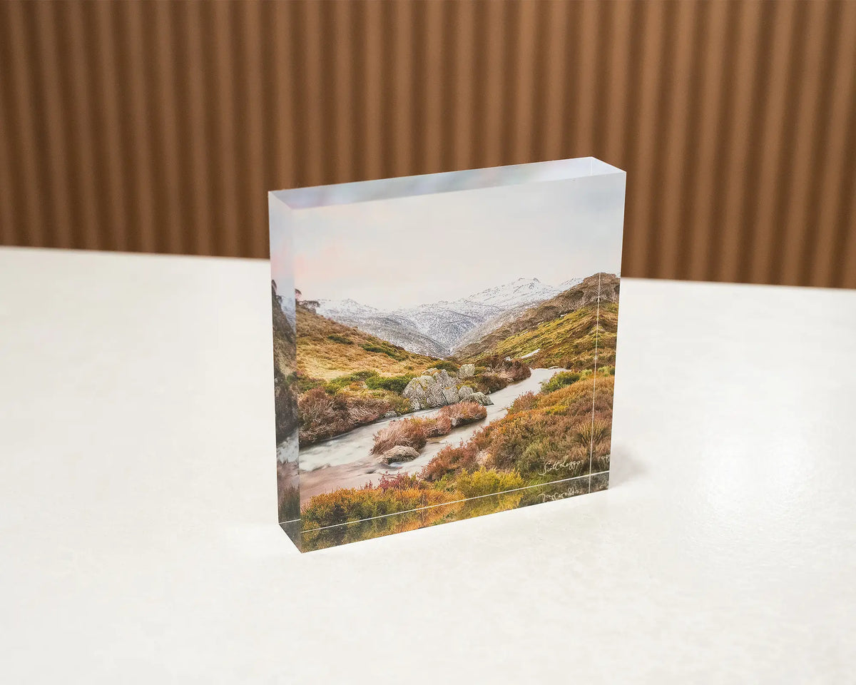 Looking Up. Acrylic block of Thredbo River, Kosciuszko National Park, sitting on a desk.