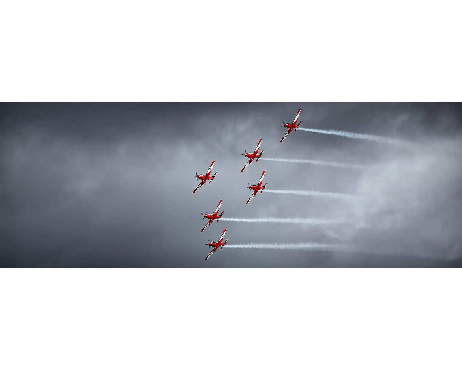 Low Show. RAAF Roulettes against stormy sky