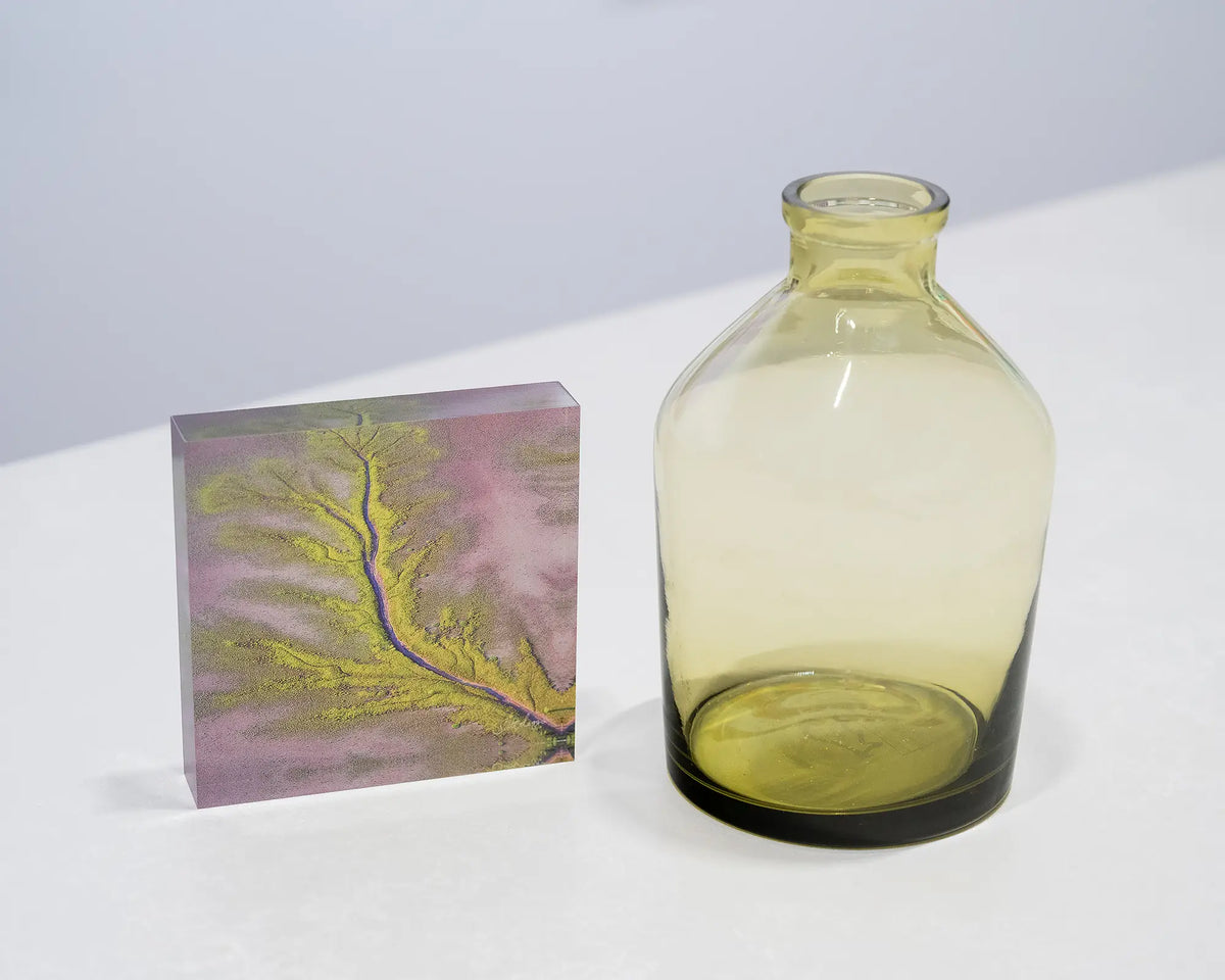 Lumination. Acrylic block King River, The Kimberley, styled with a small vase.