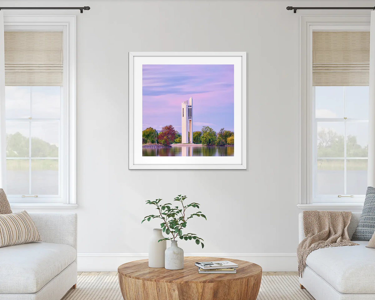 Magenta Dawn. National Carillon at sunrise wall art print with white frame hung on lounge room wall.
