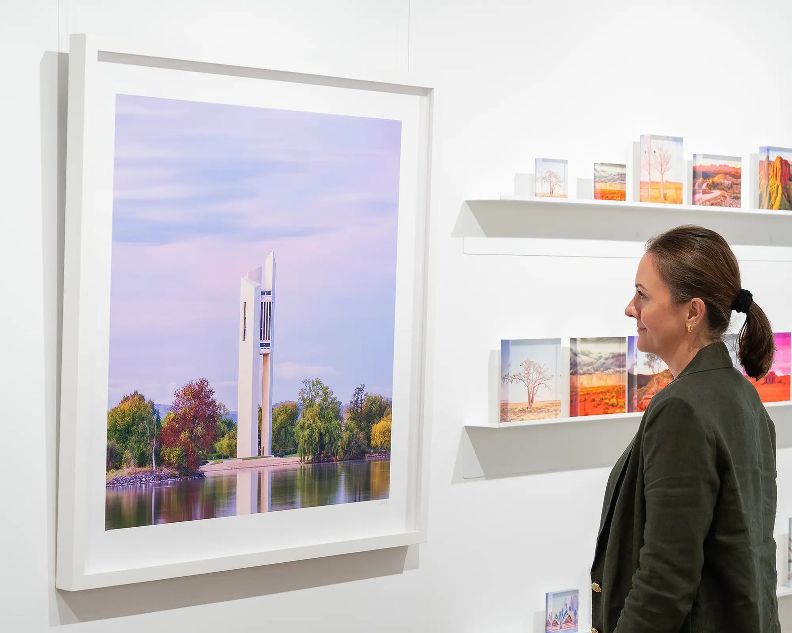Framed photograph of the Carillon on the lake with a purple sunrise.