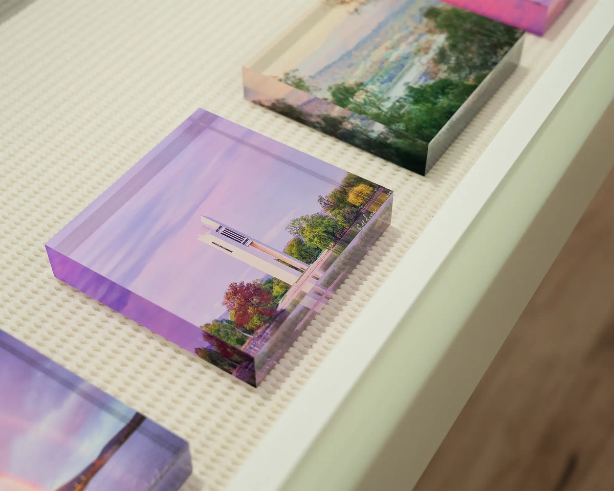 Magenta Dawn. Small acrylic block of sunrise at National Carillon, in gallery drawer with Canberra acrylic blocks.