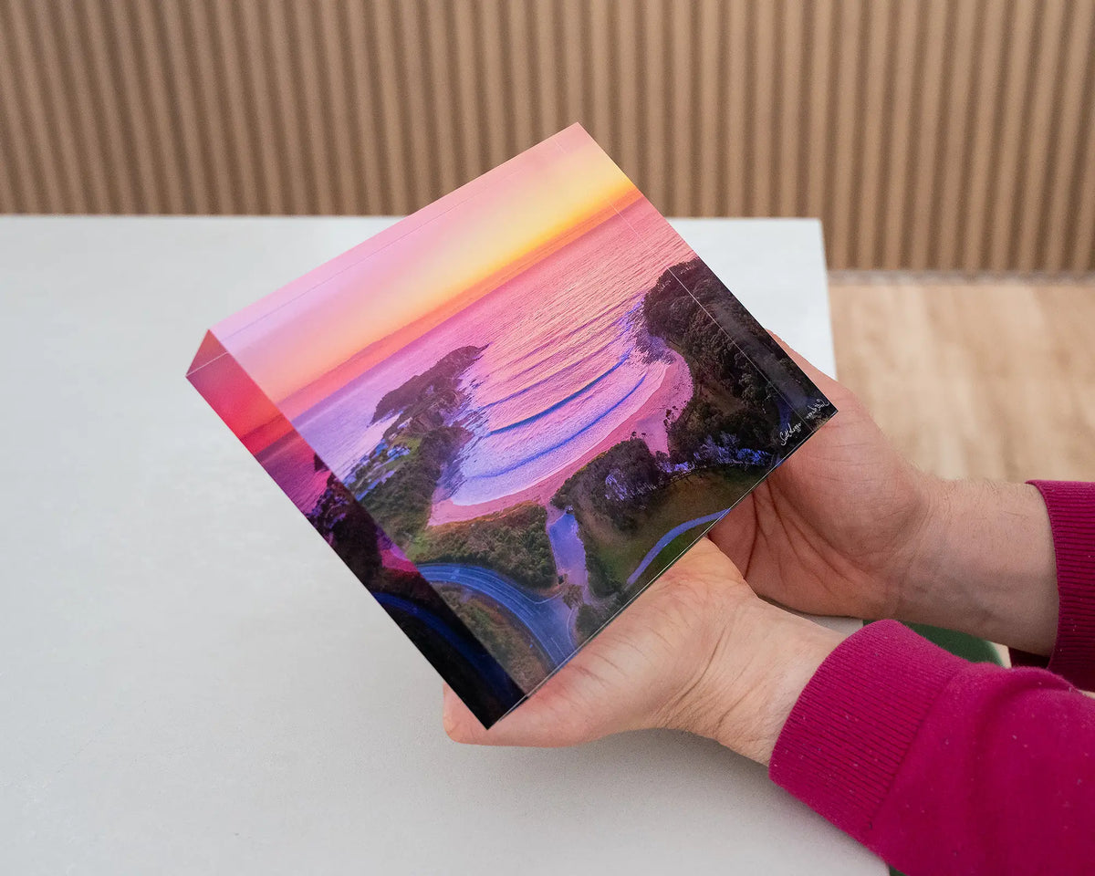 McKenzies Glow. Acrylic block of sunrise over McKenzies Beach, South Coast, being hand held.