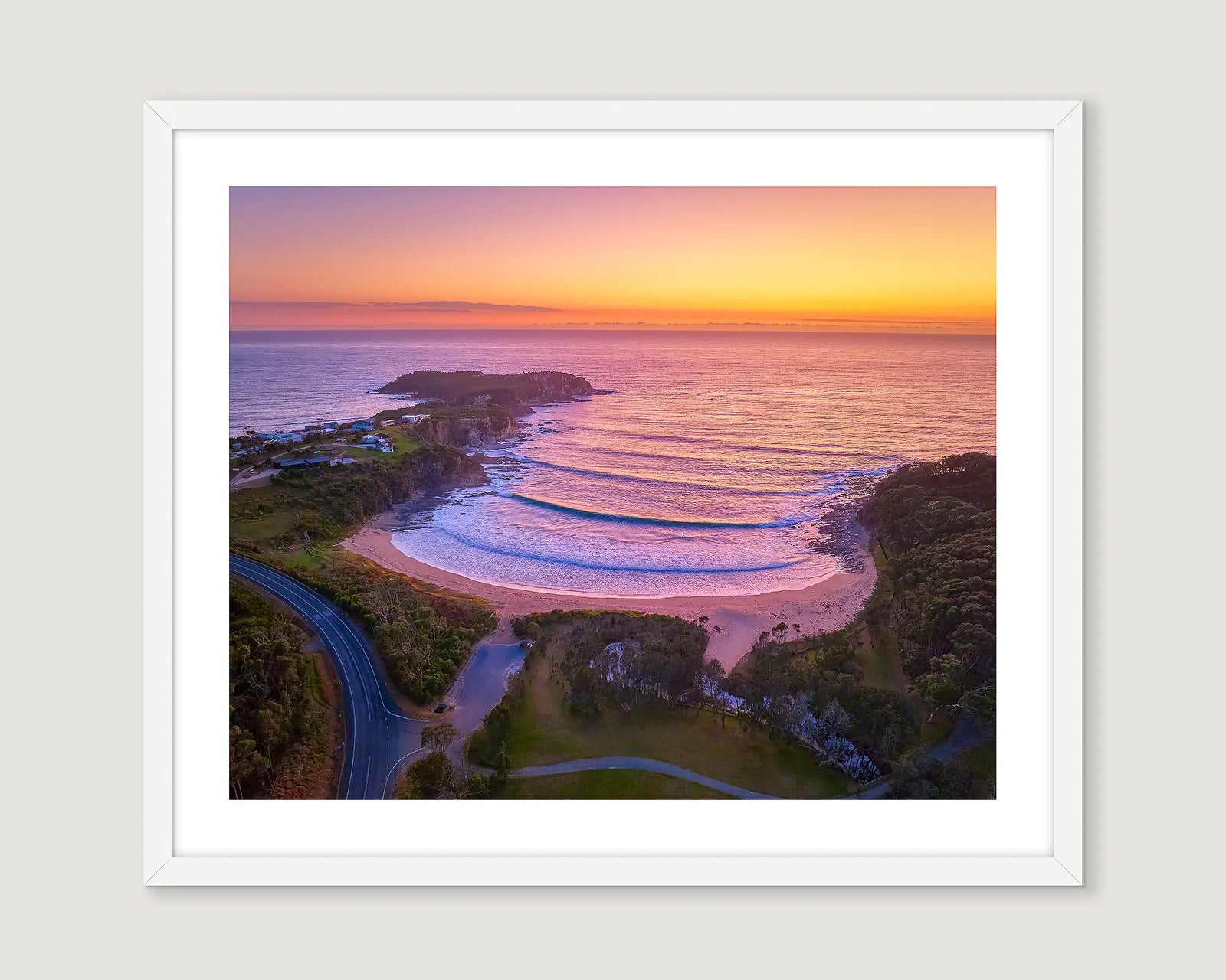 Framed photograph of McKenzies Beach at sunrise.