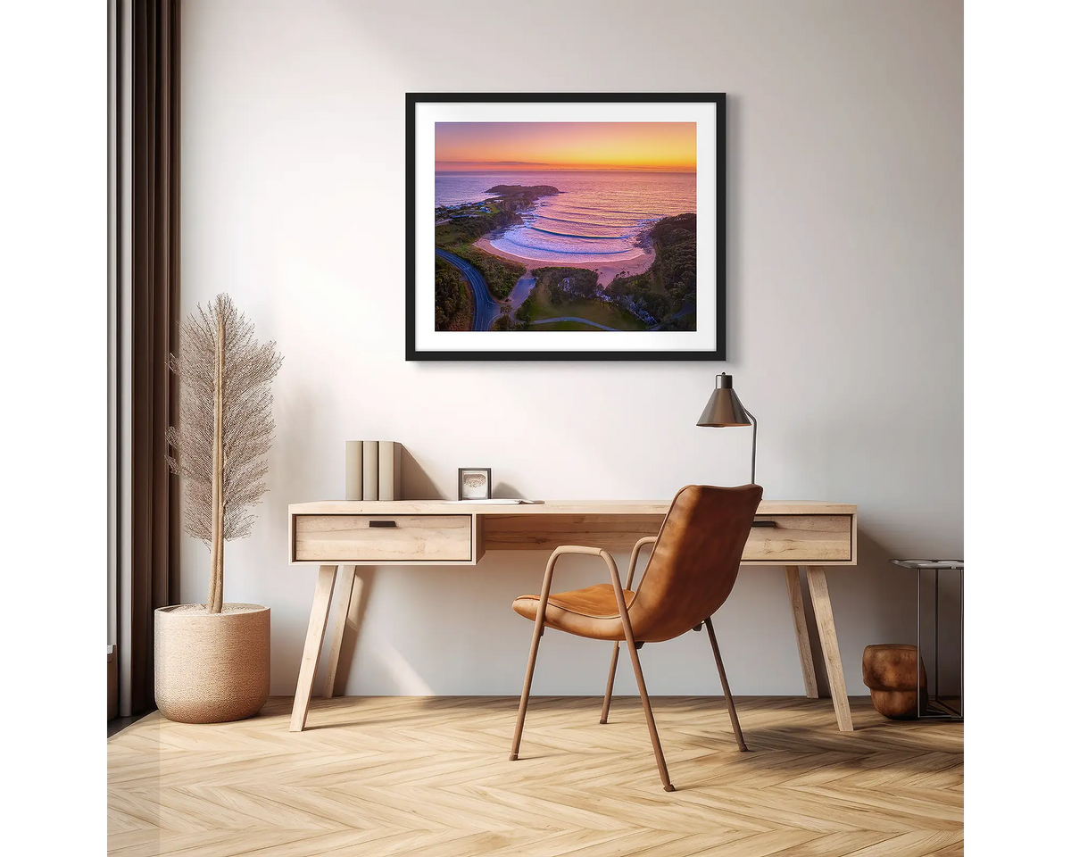 McKenzie&#39;s Glow. South Coast photographic wall art print with a black frame, hung above a scandi office desk. 