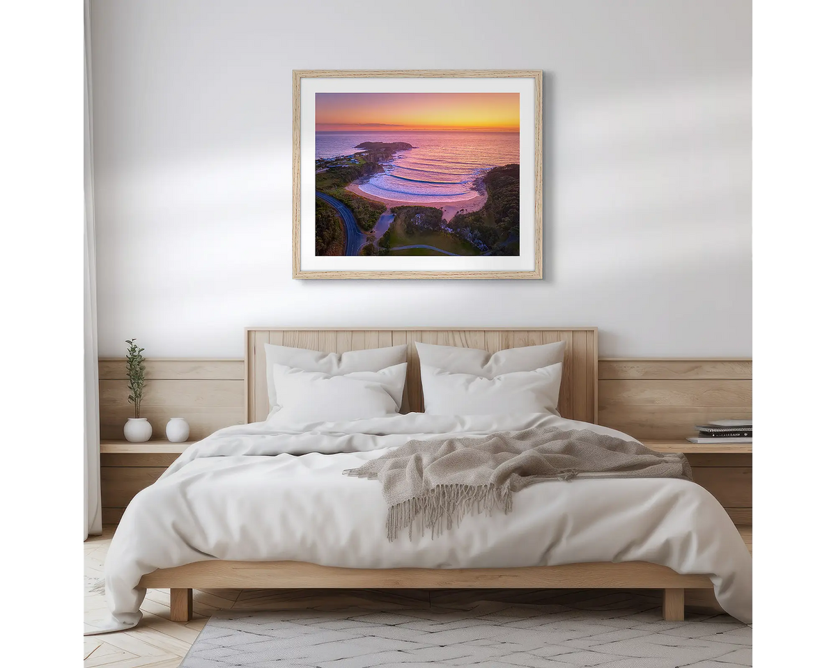 McKenzie&#39;s Glow. South Coast photographic wall art print, with a timber frame, hung in a scandi bedroom. 