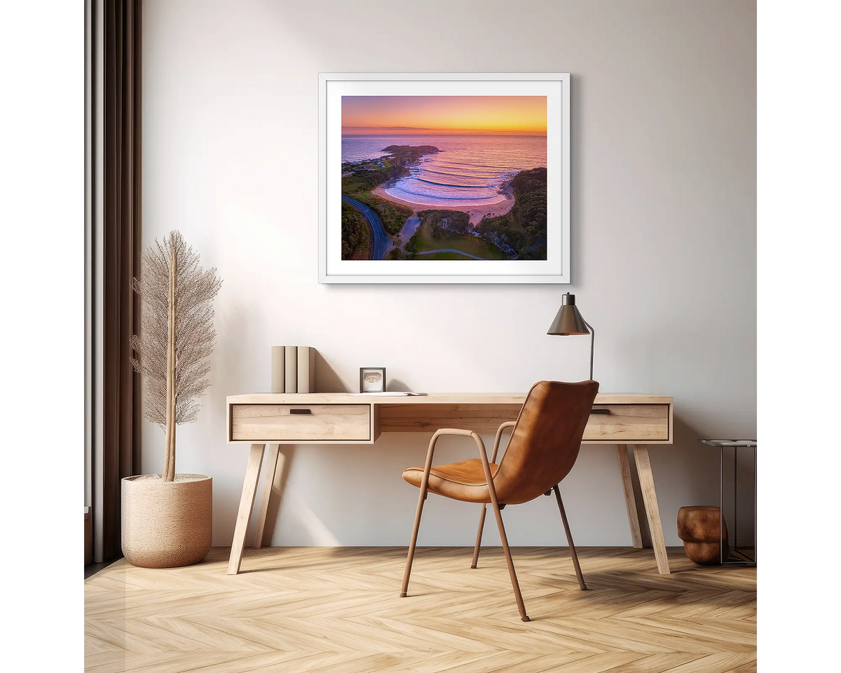 McKenzie&#39;s Glow. South Coast photographic wall art print with a white frame, hung above a scandi office desk. 