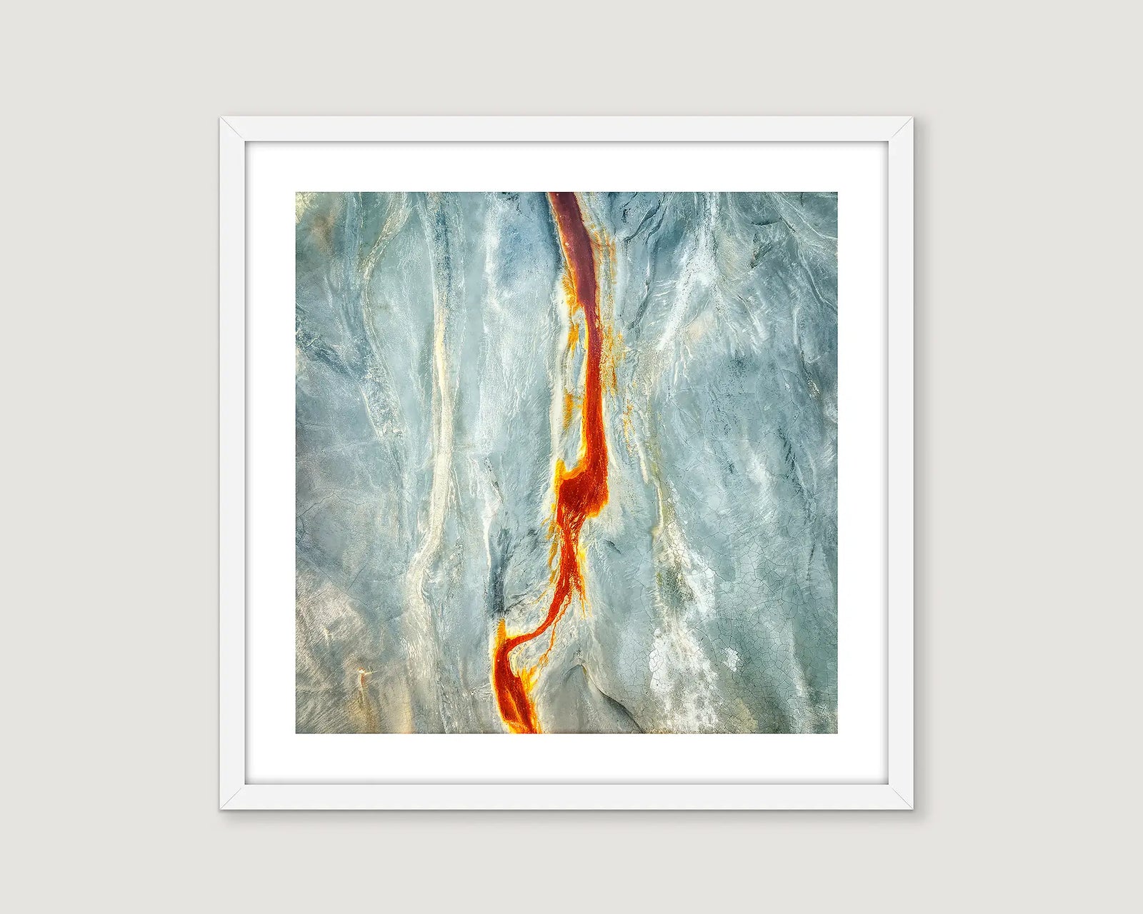 Framed abstract photograph of blue, white, red and yellow.