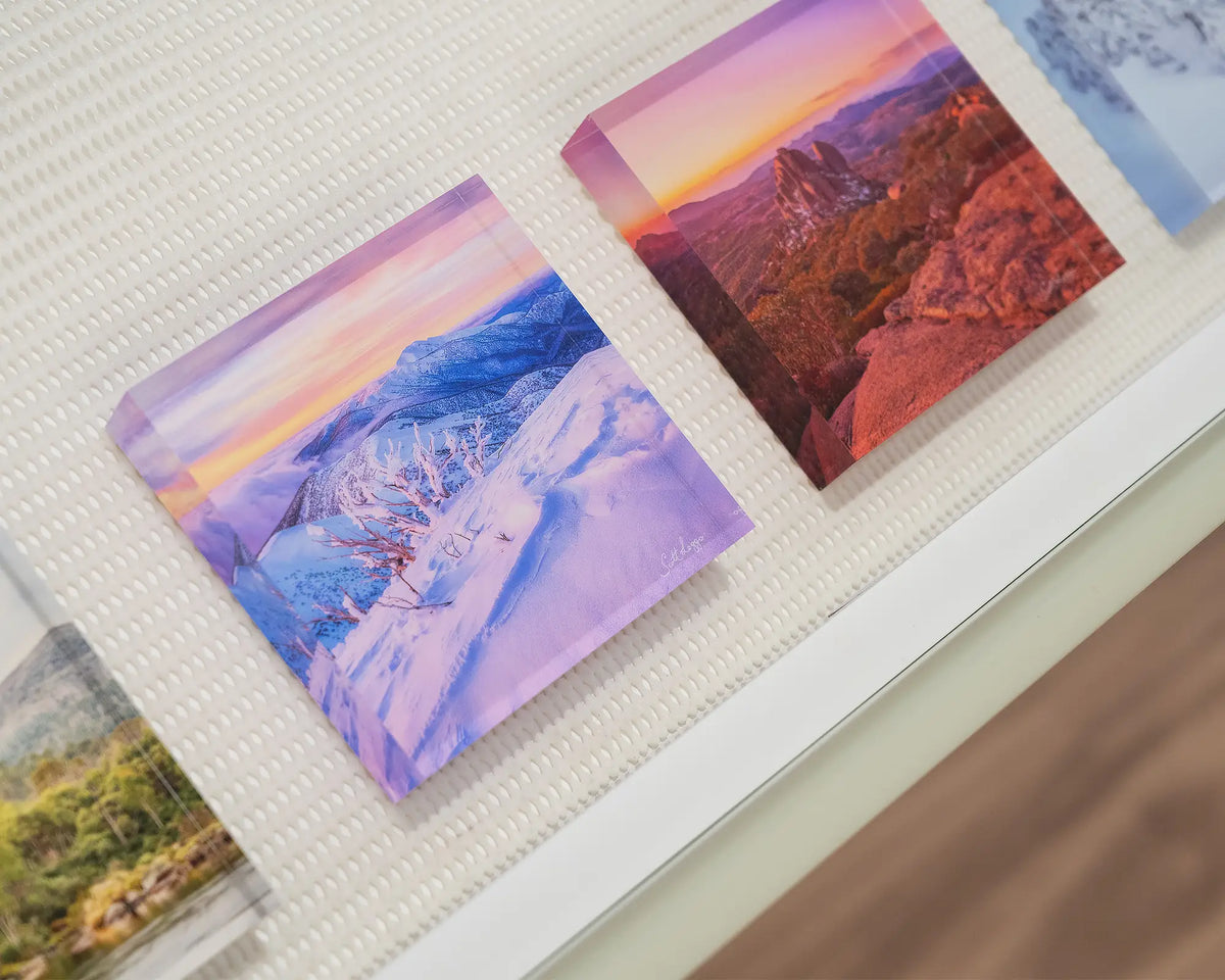 Memories Of Winter. Acrylic block of sunset light over Mount Feathertop, in gallery drawer with more alpine acrylic blocks.