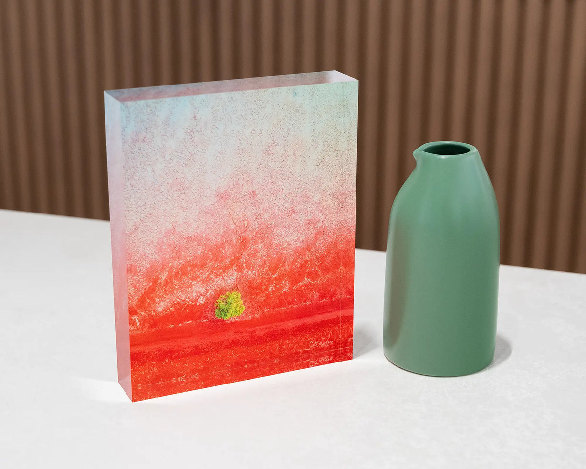 Mini. Acrylic block aerial artwork Broome, The Kimberley, on desk styled with a small vase.