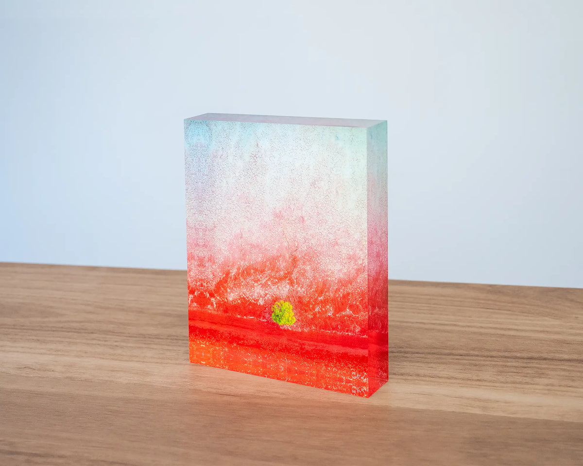 Mini. Acrylic block aerial artwork Broome, The Kimberley, sitting on desk.