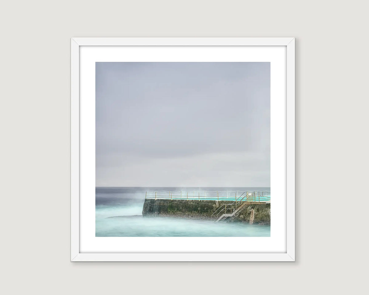 Framed photograph of Icebergs Bondi on a cloudy day.