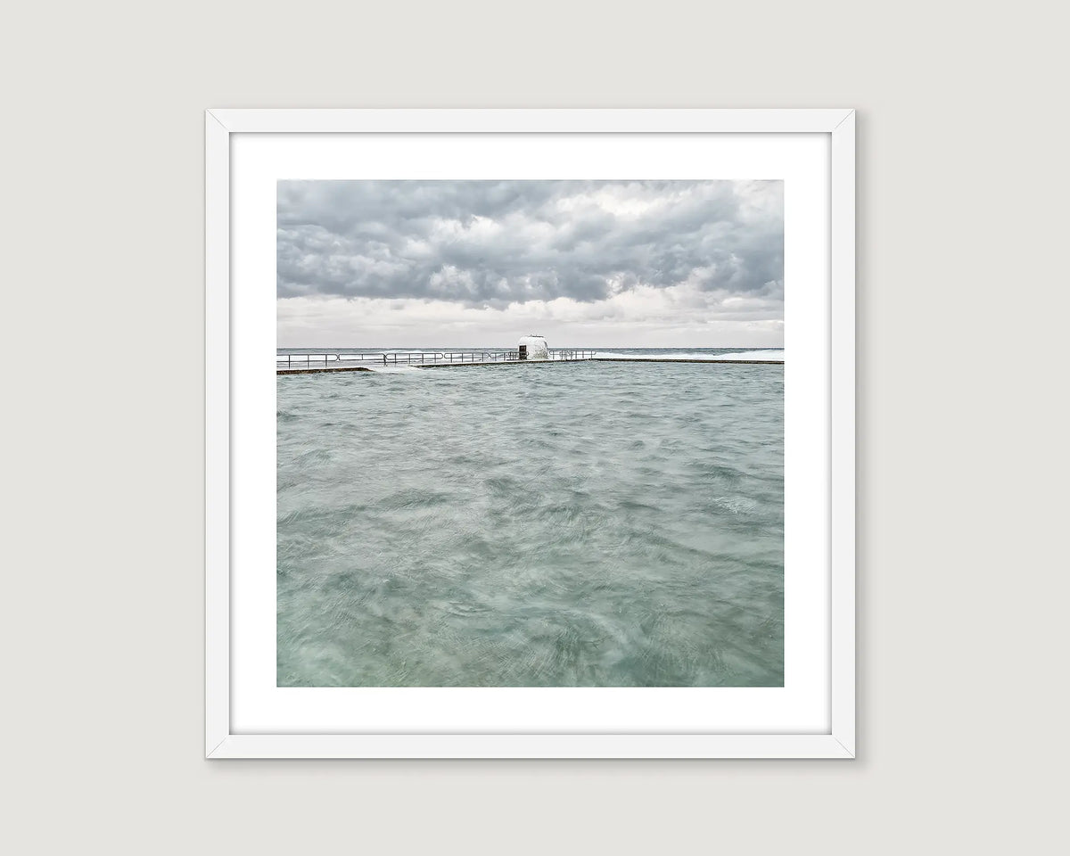 Framed photograph of Merewether Ocean Baths on a cloudy day.