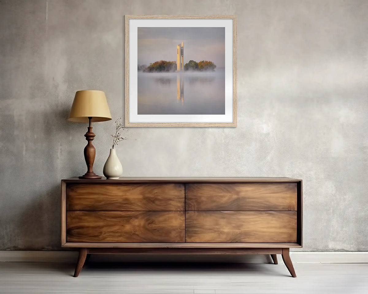 Morning Fog. Wall art print of the National Carillon in Canberra, framed with a Tassie Oak frame, and hung above a side table. 