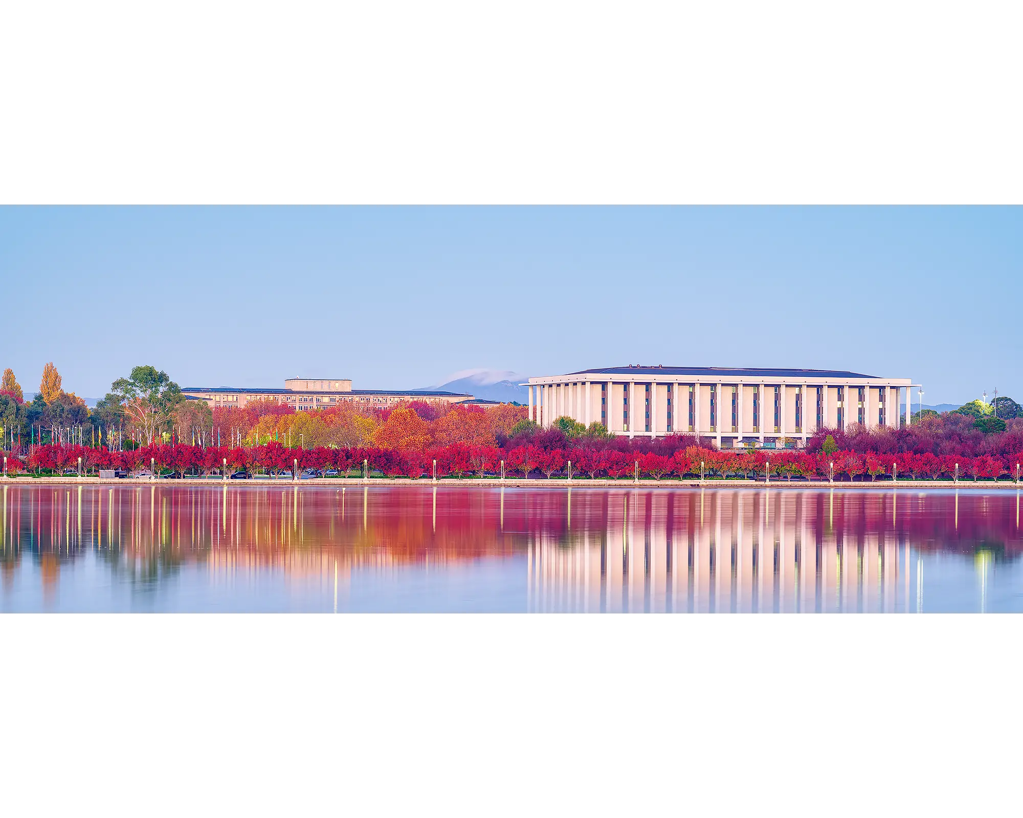 Morning Reds. National Library with red autumn colours reflecting in Lake Burley Griffin.
