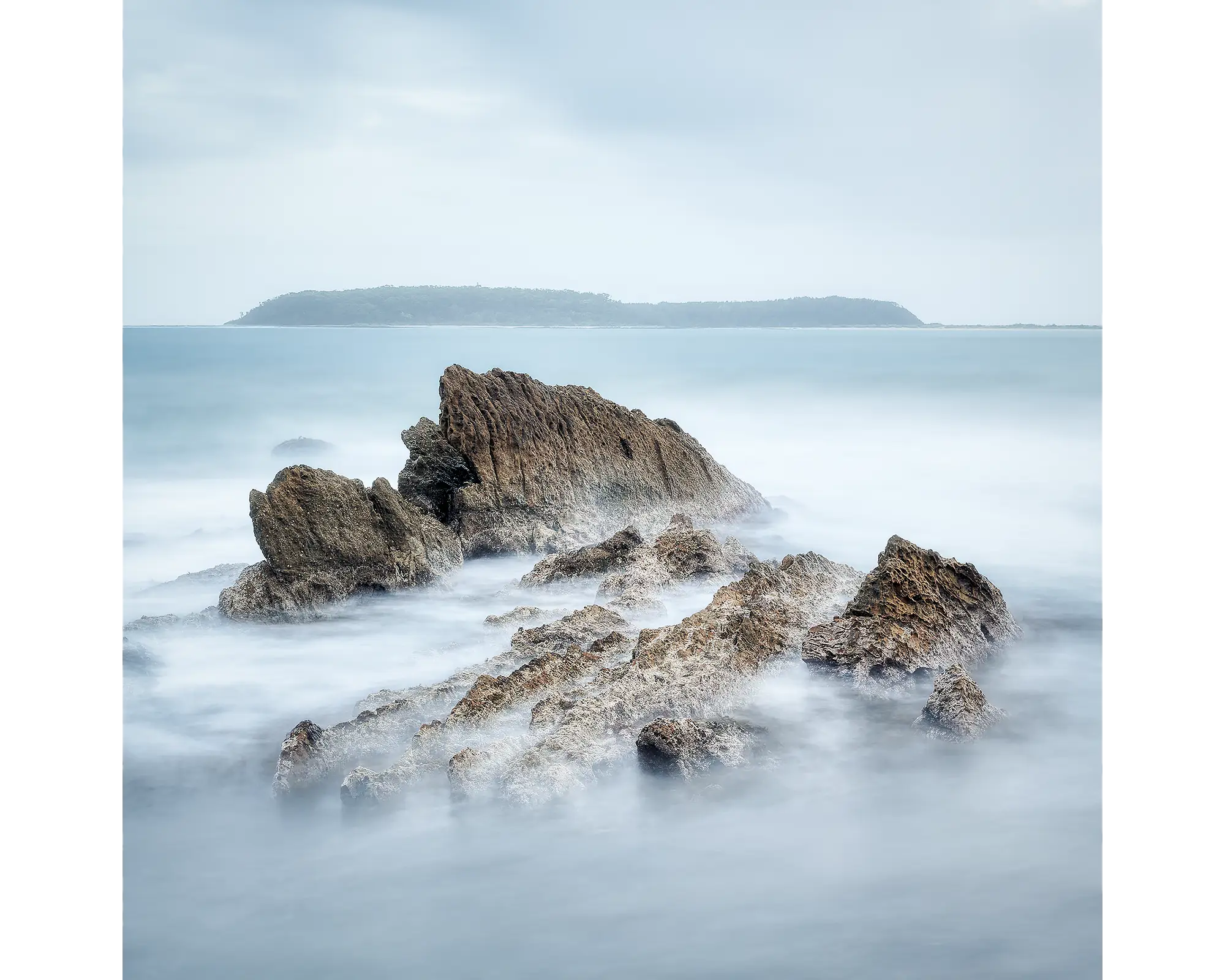 Mossy Point rocks and Broulee Island, New South Wales, Australia.