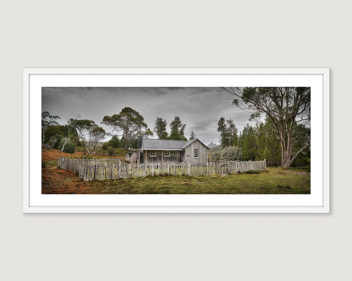 Framed photograph of a Mount Kate House on a cloudy day.